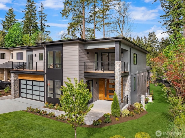 11320 113th Pl NE, Kirkland, WA 98033 - modern home with a balcony, a front yard, an attached garage, concrete driveway, and stone siding