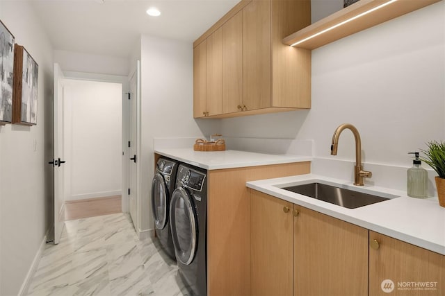 11320 113th Pl NE, Kirkland, WA 98033 - laundry area with separate washer and dryer, cabinet space, light marble finish flooring, recessed lighting, and baseboards