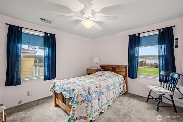 513 K St SW, Quincy, WA 98848 - carpeted bedroom featuring multiple windows and a ceiling fan