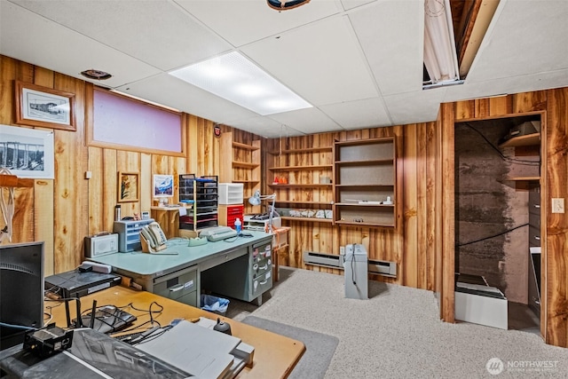 513 K St SW, Quincy, WA 98848 - carpeted office with wooden walls, baseboard heating, built in shelves, and a drop ceiling