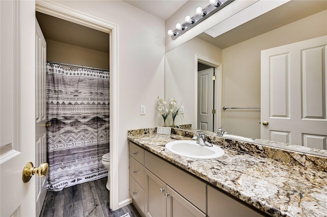 20524 73rd Dr SE, Snohomish, WA 98296 - full bathroom featuring toilet, wood finished floors, vanity, and curtained shower