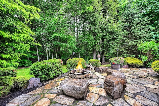 20524 73rd Dr SE, Snohomish, WA 98296 - view of patio with an outdoor fire pit