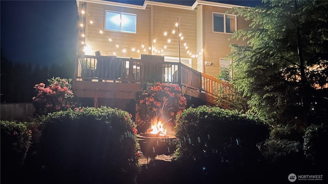 20524 73rd Dr SE, Snohomish, WA 98296 - back of house at twilight featuring a wooden deck