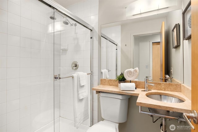 3818 S Hudson St Unit A, Seattle, WA 98118 - bathroom featuring a sink, a shower stall, and toilet