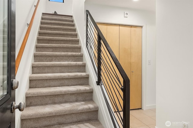 3818 S Hudson St Unit A, Seattle, WA 98118 - staircase with tile patterned floors