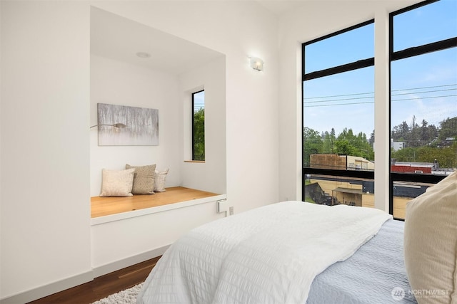 3818 S Hudson St Unit A, Seattle, WA 98118 - bedroom featuring dark wood-type flooring and baseboards