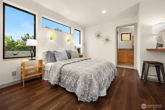 3818 S Hudson St Unit A, Seattle, WA 98118 - bedroom featuring wood finished floors, recessed lighting, a sink, baseboards, and ensuite bath