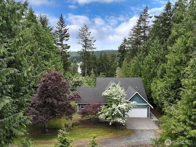 5257 April Dr, Langley, WA 98260 - view of front of property with driveway and a view of trees