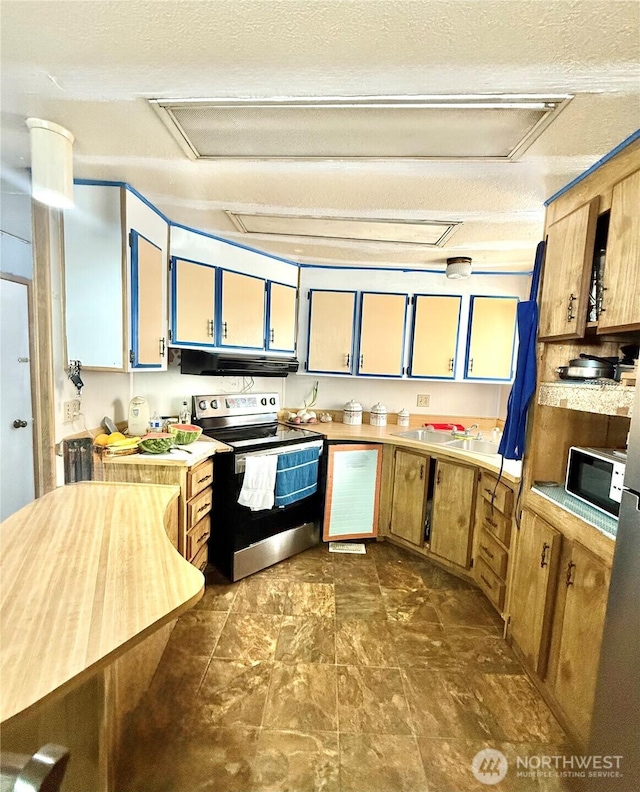 3333 SE 228th St Unit 105, Bothell, WA 98021 - kitchen with stainless steel electric range oven, under cabinet range hood, light countertops, a sink, and a textured ceiling