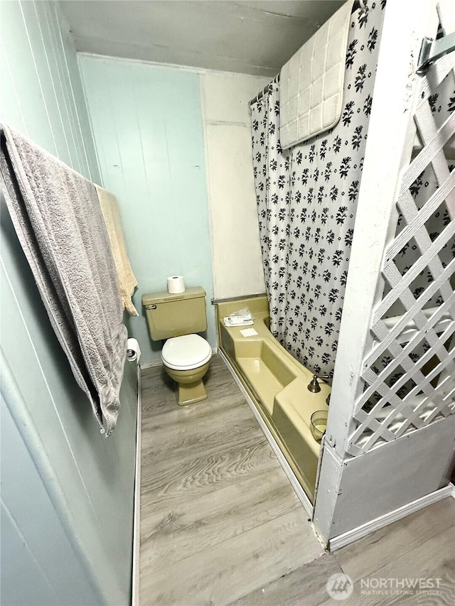 3333 SE 228th St Unit 105, Bothell, WA 98021 - bathroom featuring wood finished floors, a shower with shower curtain, and toilet