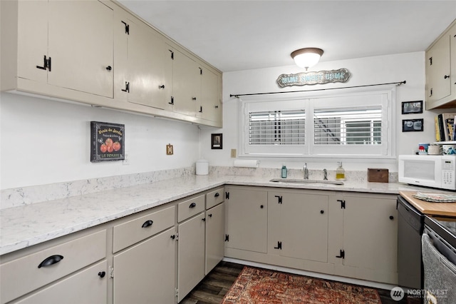 187 S A St, Buckley, WA 98321 - kitchen featuring white microwave, a sink, dark wood-style flooring, dishwasher, and electric range oven