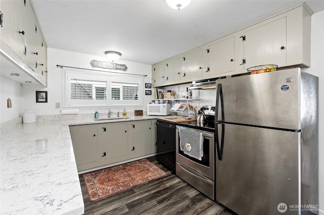 187 S A St, Buckley, WA 98321 - kitchen with stainless steel appliances, a sink, dark wood-style floors, and ventilation hood
