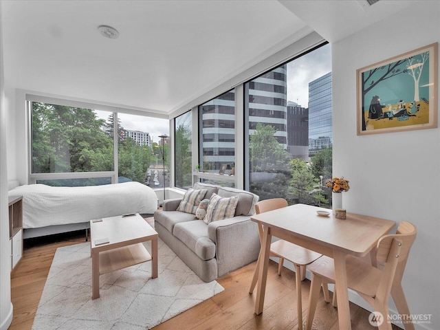 1808 Minor Ave Unit 501, Seattle, WA 98101 - bedroom with light wood-style flooring and a city view