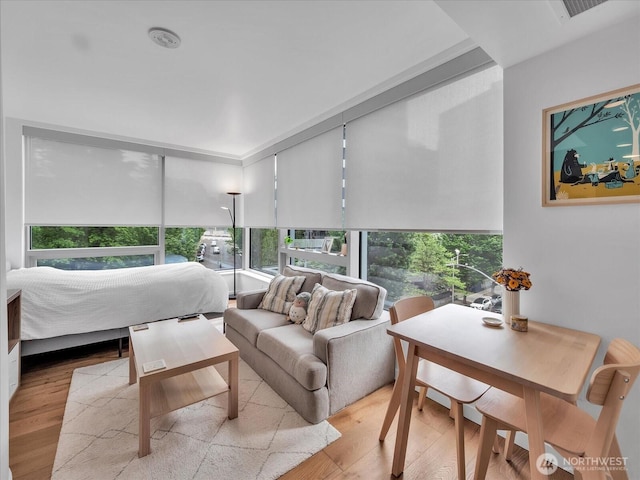1808 Minor Ave Unit 501, Seattle, WA 98101 - sunroom featuring outdoor lounge area, plenty of natural light, and wood finished floors