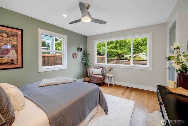 9419 39th Ave S, Seattle, WA 98118 - bedroom with wood finished floors, baseboards, a ceiling fan, and recessed lighting