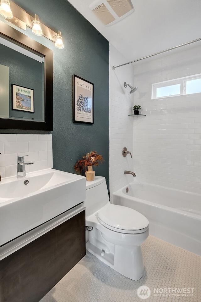 9419 39th Ave S, Seattle, WA 98118 - bathroom with toilet, shower / bathtub combination, vanity, decorative backsplash, and tile patterned flooring