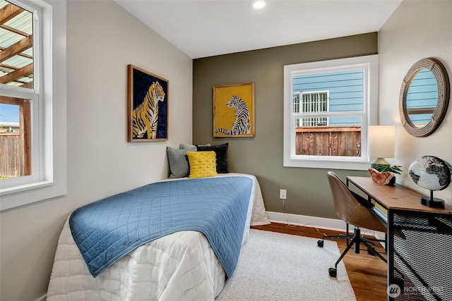9419 39th Ave S, Seattle, WA 98118 - bedroom with wood finished floors, baseboards, a desk, and recessed lighting