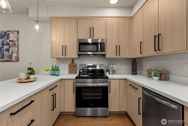 105B NW 39th St, Seattle, WA 98107 - kitchen featuring appliances with stainless steel finishes, light brown cabinets, and light countertops
