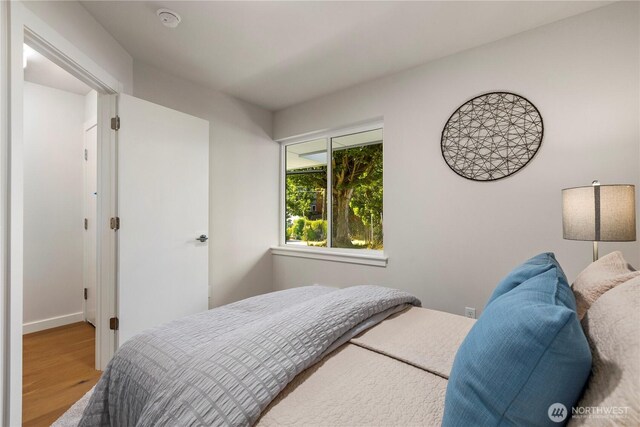 105B NW 39th St, Seattle, WA 98107 - bedroom featuring wood finished floors and baseboards