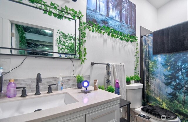 44094411 21st Ct SE, Lacey, WA 98503 - bathroom with vanity, toilet, a shower with shower curtain, and tasteful backsplash