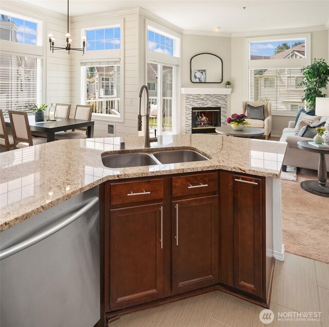 23503 55th Ave S, Kent, WA 98032 - kitchen featuring dishwasher, a sink, a fireplace, ornamental molding, and open floor plan