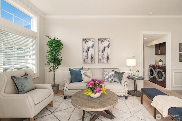 23503 55th Ave S, Kent, WA 98032 - living room with washing machine and dryer, crown molding, and a decorative wall