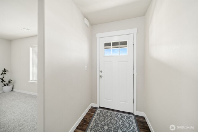 1620 2nd Ave SW, Quincy, WA 98848 - doorway featuring plenty of natural light, baseboards, and dark wood finished floors