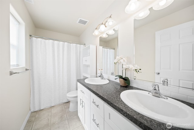 1620 2nd Ave SW, Quincy, WA 98848 - bathroom with toilet, double vanity, baseboards, tile patterned flooring, and a shower with shower curtain