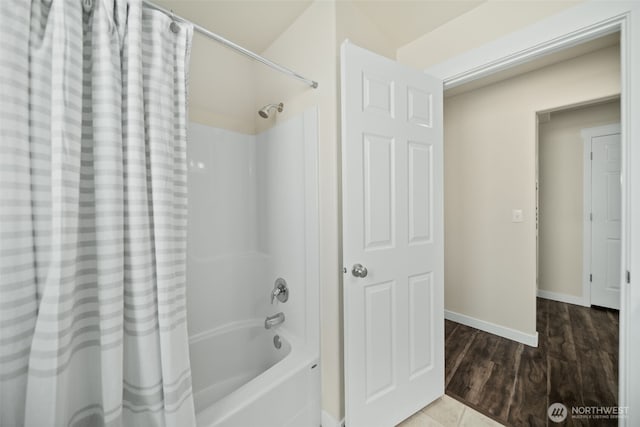 1620 2nd Ave SW, Quincy, WA 98848 - bathroom featuring shower / bath combo with shower curtain, wood finished floors, and baseboards