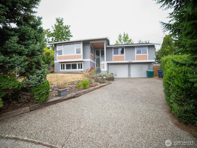 2840 SW 342nd St, Federal Way, WA 98023 - raised ranch featuring driveway, an attached garage, and stairway