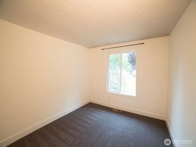 2840 SW 342nd St, Federal Way, WA 98023 - empty room featuring dark colored carpet and a textured ceiling