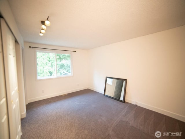 2840 SW 342nd St, Federal Way, WA 98023 - unfurnished room featuring dark carpet and baseboards
