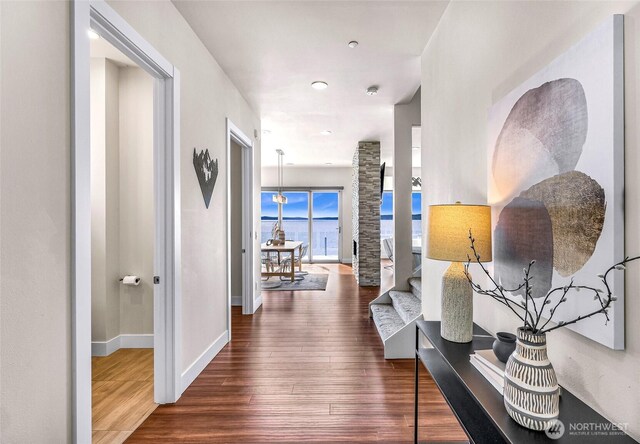 12065 30th Ave SW, Burien, WA 98146 - hall with wood finished floors, baseboards, and a water view