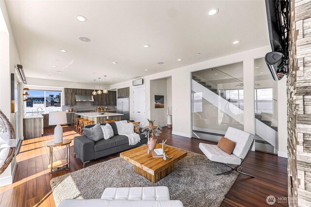 12065 30th Ave SW, Burien, WA 98146 - living area featuring recessed lighting, dark wood-style flooring, a chandelier, and baseboards