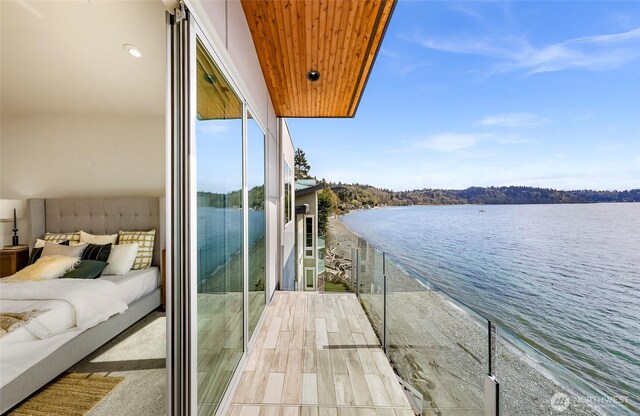 12065 30th Ave SW, Burien, WA 98146 - balcony featuring a water view and an outdoor living space