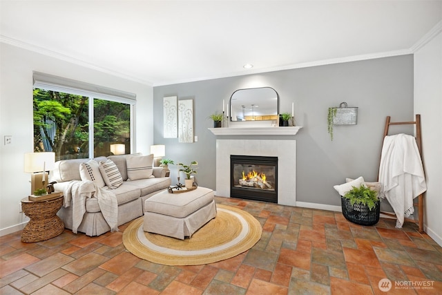 10820 NE 144th Ct, Kirkland, WA 98034 - living area featuring a fireplace, ornamental molding, baseboards, stone finish flooring, and recessed lighting