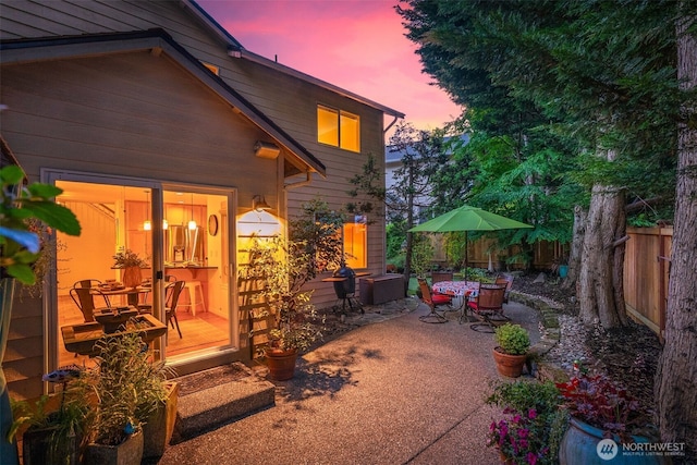 10820 NE 144th Ct, Kirkland, WA 98034 - patio terrace at dusk featuring outdoor dining area and a patio