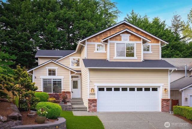 10820 NE 144th Ct, Kirkland, WA 98034 - craftsman house featuring a garage, concrete driveway, brick siding, and a shingled roof
