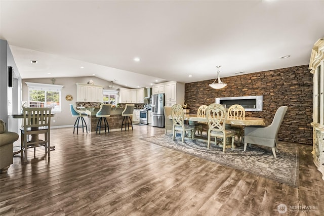 3001 163rd St E, Tacoma, WA 98446 - dining area featuring vaulted ceiling, dark wood-type flooring, recessed lighting, and baseboards