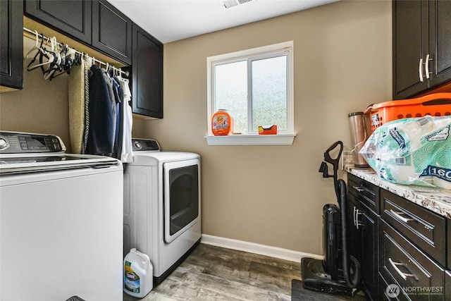 3001 163rd St E, Tacoma, WA 98446 - laundry area featuring cabinet space, washing machine and dryer, dark wood finished floors, and baseboards