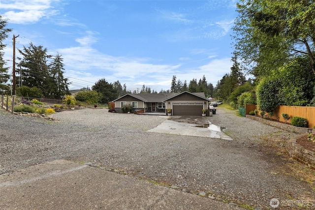 3001 163rd St E, Tacoma, WA 98446 - ranch-style home with an attached garage and gravel driveway