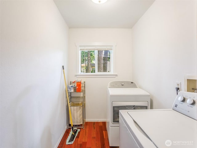 6810 Mount Tacoma Dr SW, Lakewood, WA 98499 - washroom with washing machine and clothes dryer, wood finished floors, and baseboards