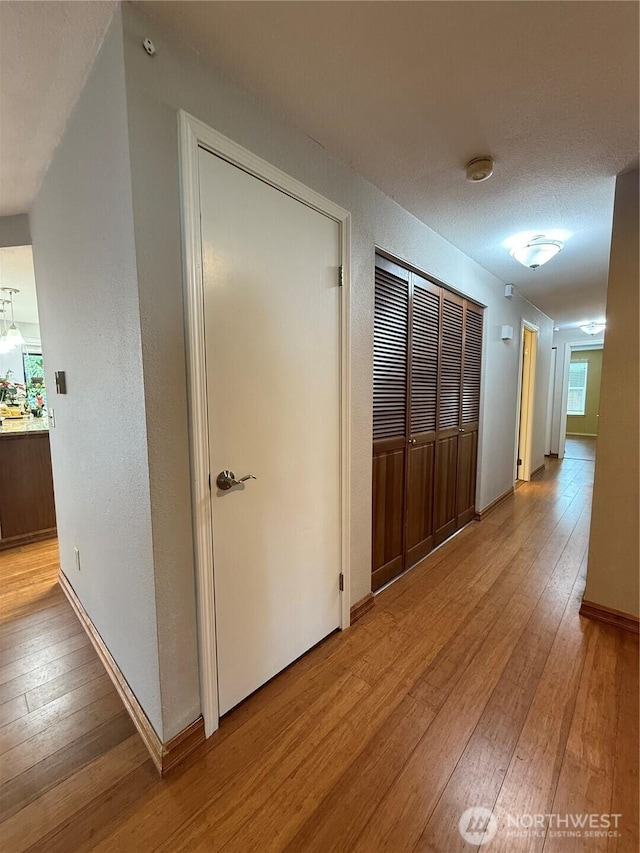 21849 SE 266th Pl, Maple Valley, WA 98038 - hall featuring light wood-type flooring and baseboards