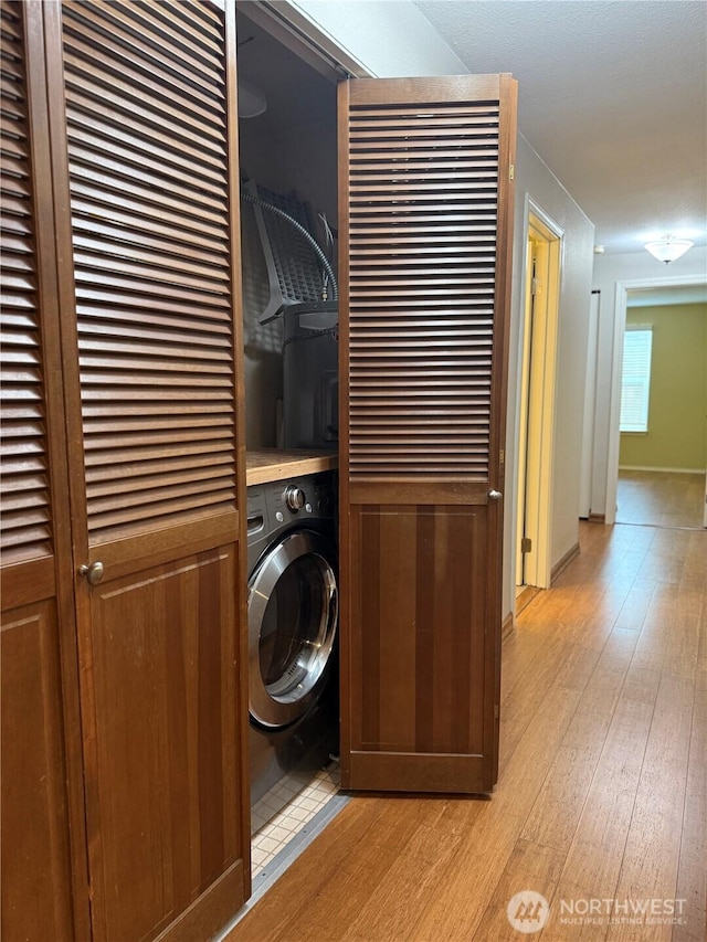 21849 SE 266th Pl, Maple Valley, WA 98038 - washroom featuring washer / dryer and light wood-type flooring