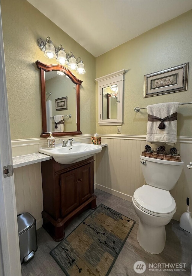 21849 SE 266th Pl, Maple Valley, WA 98038 - bathroom featuring wainscoting, vanity, toilet, and wood finished floors