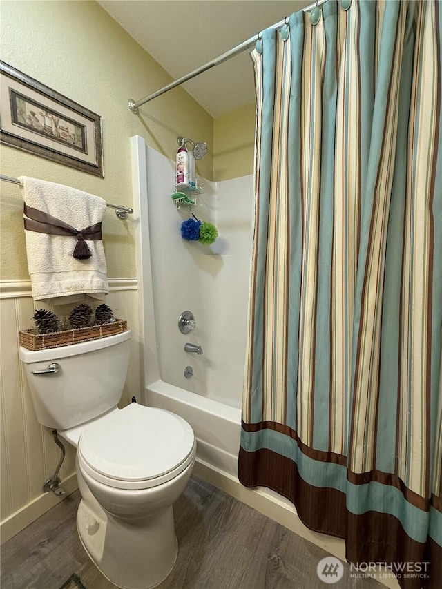 21849 SE 266th Pl, Maple Valley, WA 98038 - full bathroom featuring wood finished floors, toilet, and shower / bath combo with shower curtain