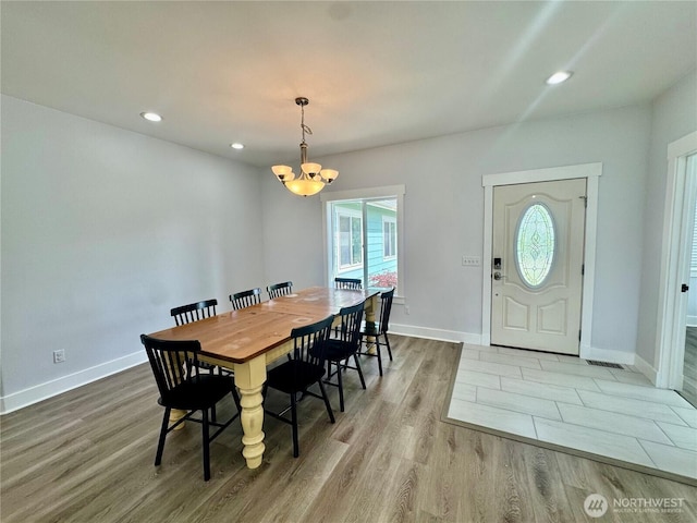 31 Apple Meadow Dr, Tonasket, WA 98855 - dining area featuring a chandelier, wood finished floors, baseboards, and recessed lighting