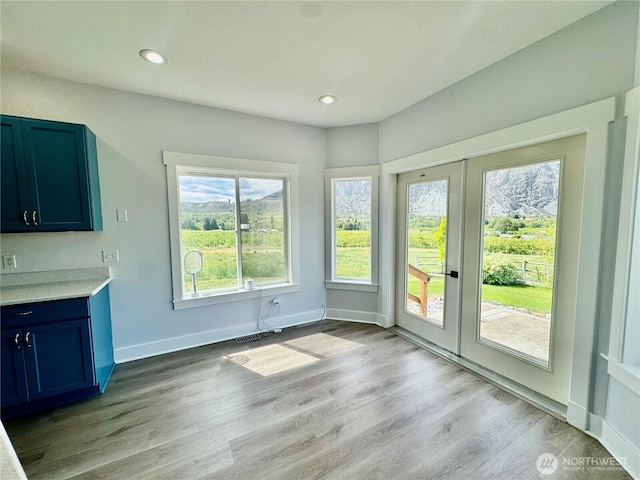 31 Apple Meadow Dr, Tonasket, WA 98855 - unfurnished dining area featuring light wood finished floors, recessed lighting, baseboards, and french doors