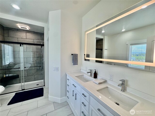 31 Apple Meadow Dr, Tonasket, WA 98855 - bathroom featuring a shower stall, double vanity, recessed lighting, baseboards, and marble look tile flooring