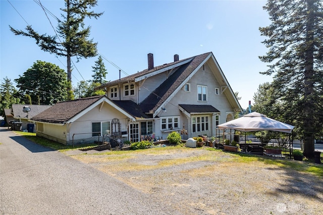 214 N 4th St, Mount Vernon, WA 98273 - back of house with a chimney and a gazebo